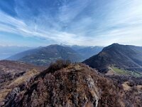 Vista verso la cima con a destra la strada che scende verso Esino, e dietro la Valsassina  dji fly 20260325 102318 68 1774430899098 pano optimized